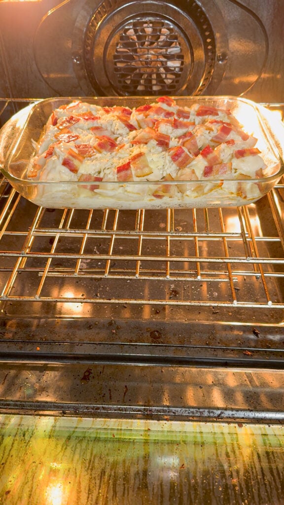chicken alfredo pierogi casserole baking in the oven after removing foil
