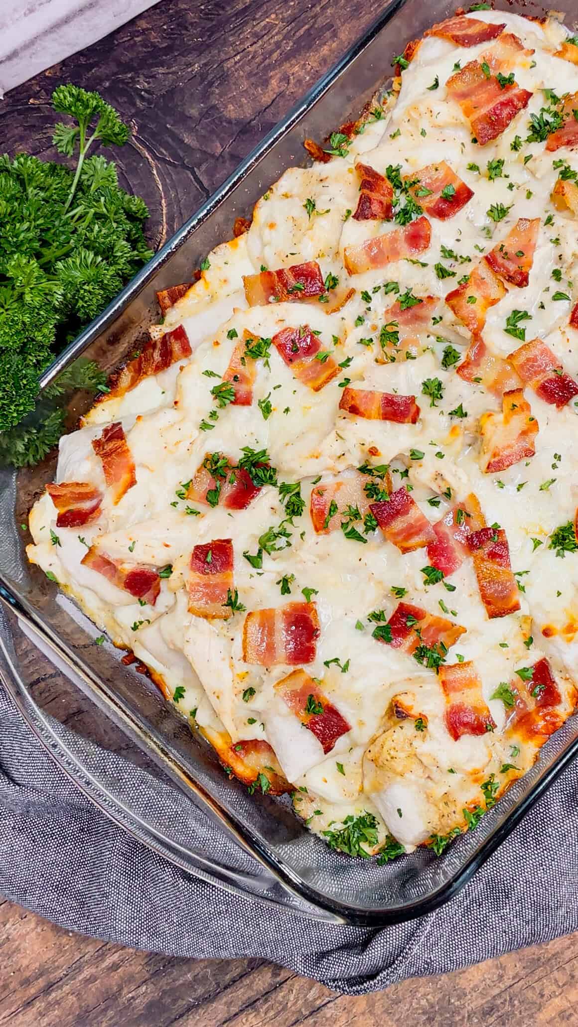 Chicken Alfredo Pierogi Casserole is an easy but hearty dinner recipe that combines two beloved classic foods into one dish. This creamy casserole is loaded with shredded rotisserie chicken, alfredo sauce, pierogies, mozzarella cheese and chopped bacon.