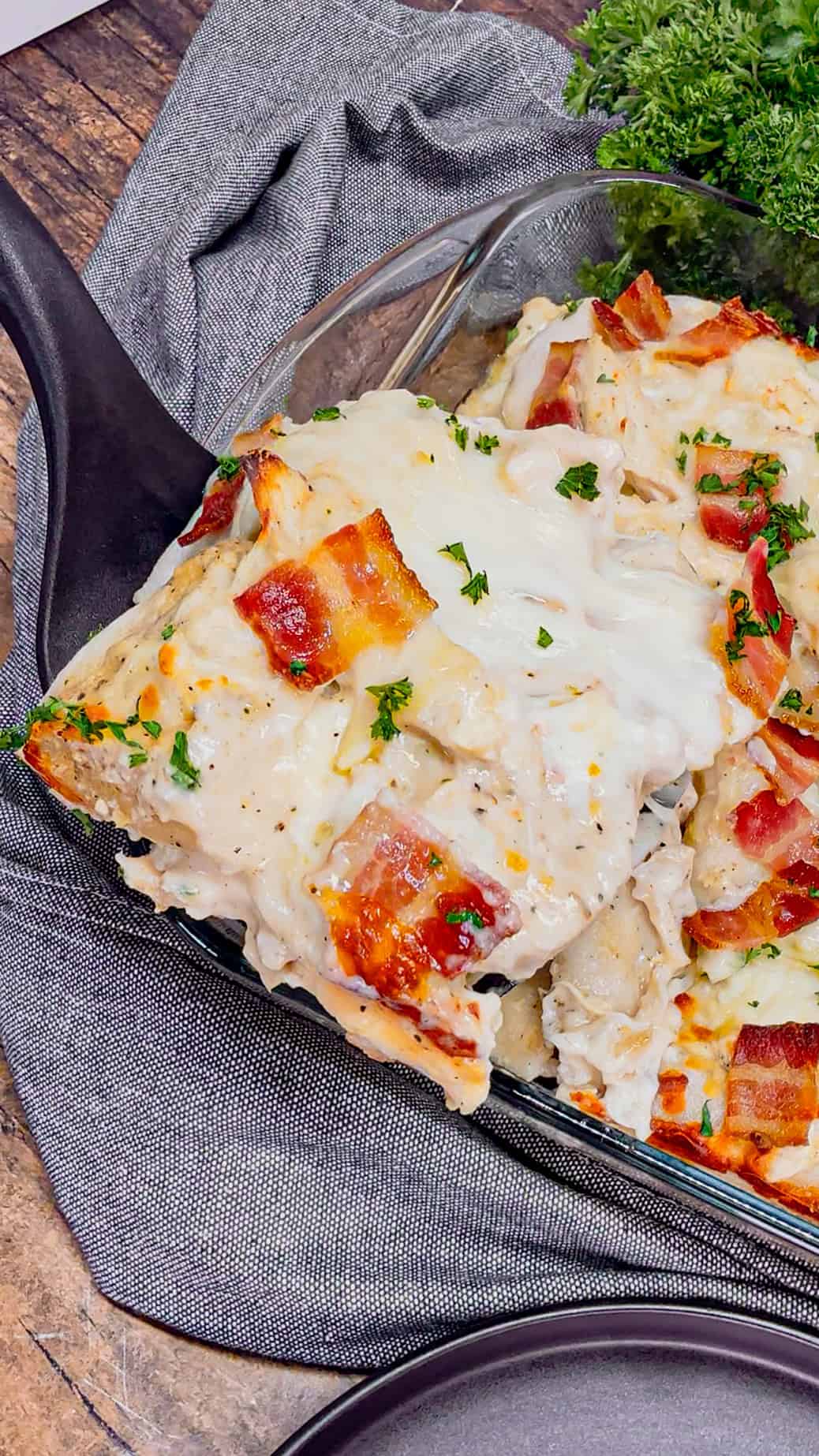 Chicken Alfredo Pierogi Casserole is an easy but hearty dinner recipe that combines two beloved classic foods into one dish. This creamy casserole is loaded with shredded rotisserie chicken, alfredo sauce, pierogies, mozzarella cheese and chopped bacon.