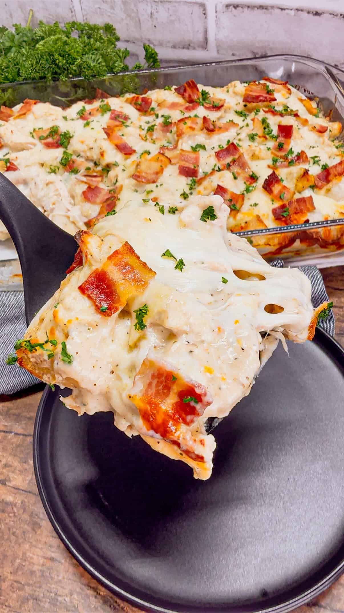 Chicken Alfredo Pierogi Casserole is an easy but hearty dinner recipe that combines two beloved classic foods into one dish. This creamy casserole is loaded with shredded rotisserie chicken, alfredo sauce, pierogies, mozzarella cheese and chopped bacon.