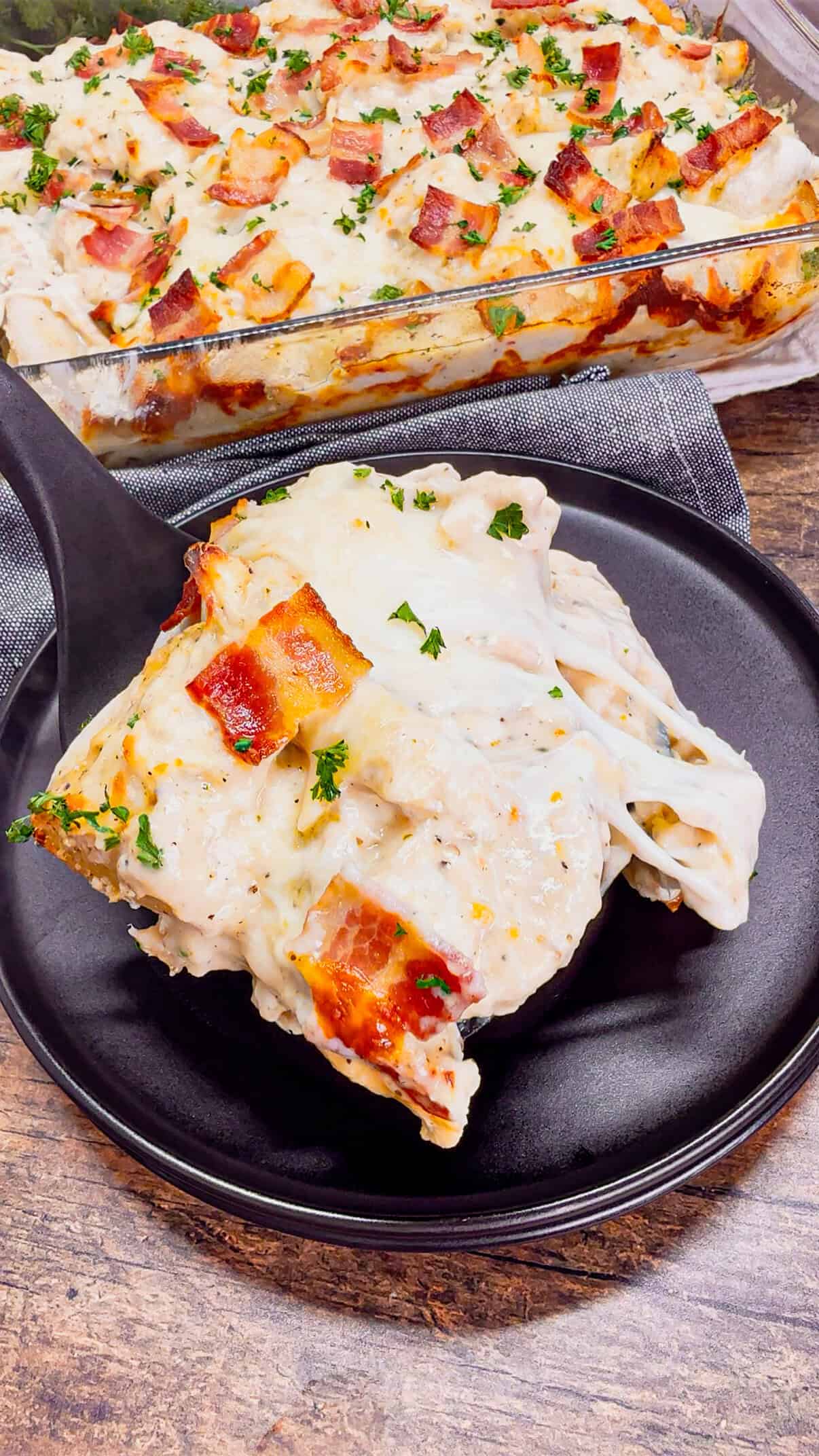 Chicken Alfredo Pierogi Casserole is an easy but hearty dinner recipe that combines two beloved classic foods into one dish. This creamy casserole is loaded with shredded rotisserie chicken, alfredo sauce, pierogies, mozzarella cheese and chopped bacon.