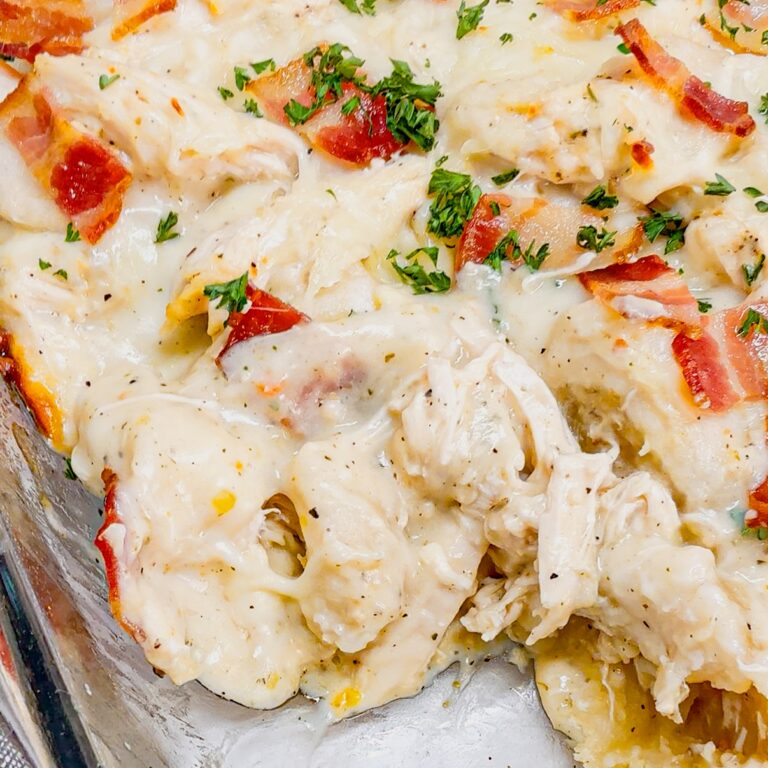 Chicken Alfredo Pierogi Casserole is an easy but hearty dinner recipe that combines two beloved classic foods into one dish. This creamy casserole is loaded with shredded rotisserie chicken, alfredo sauce, pierogies, mozzarella cheese and chopped bacon.
