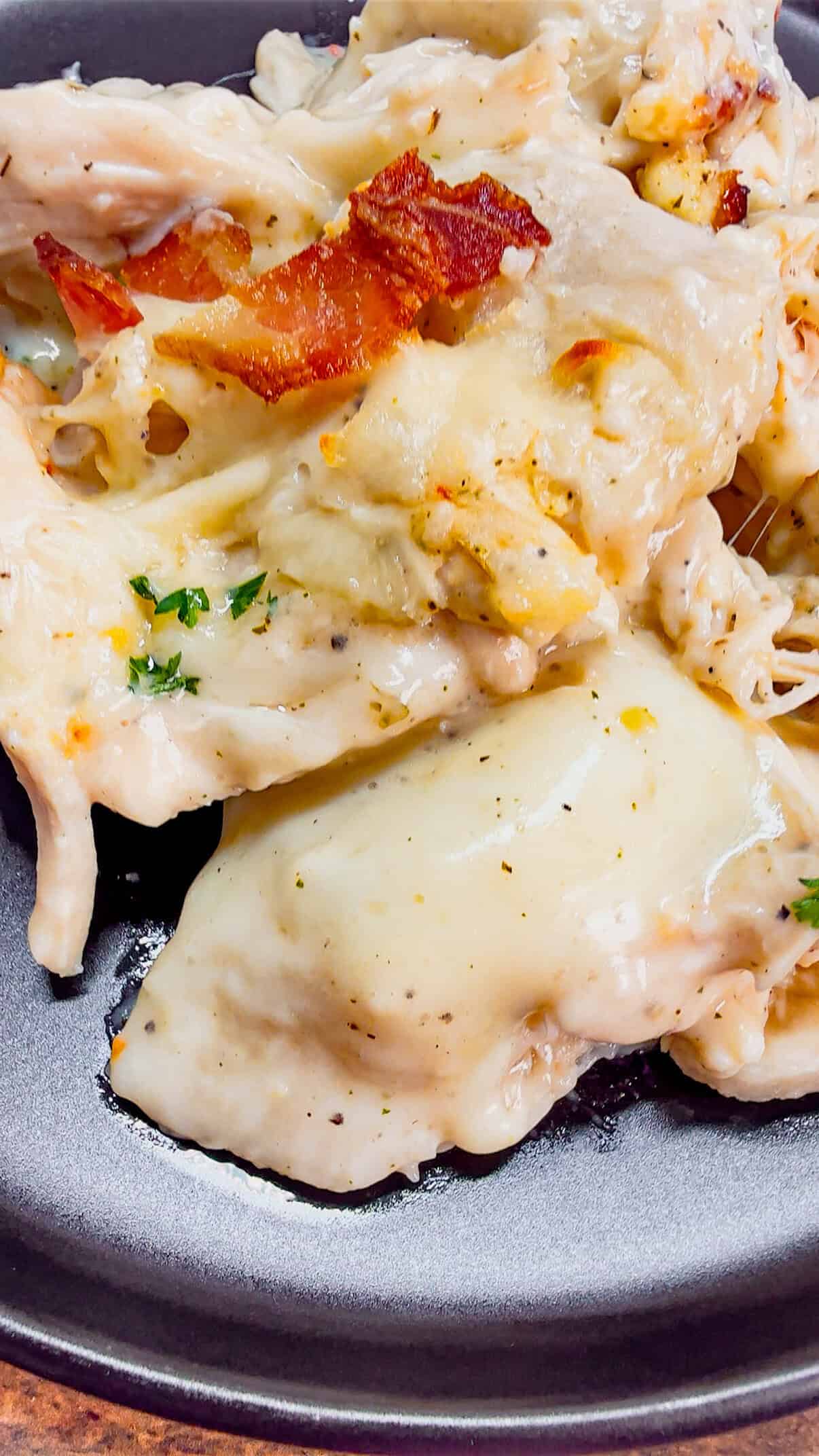Chicken Alfredo Pierogi Casserole is an easy but hearty dinner recipe that combines two beloved classic foods into one dish. This creamy casserole is loaded with shredded rotisserie chicken, alfredo sauce, pierogies, mozzarella cheese and chopped bacon.