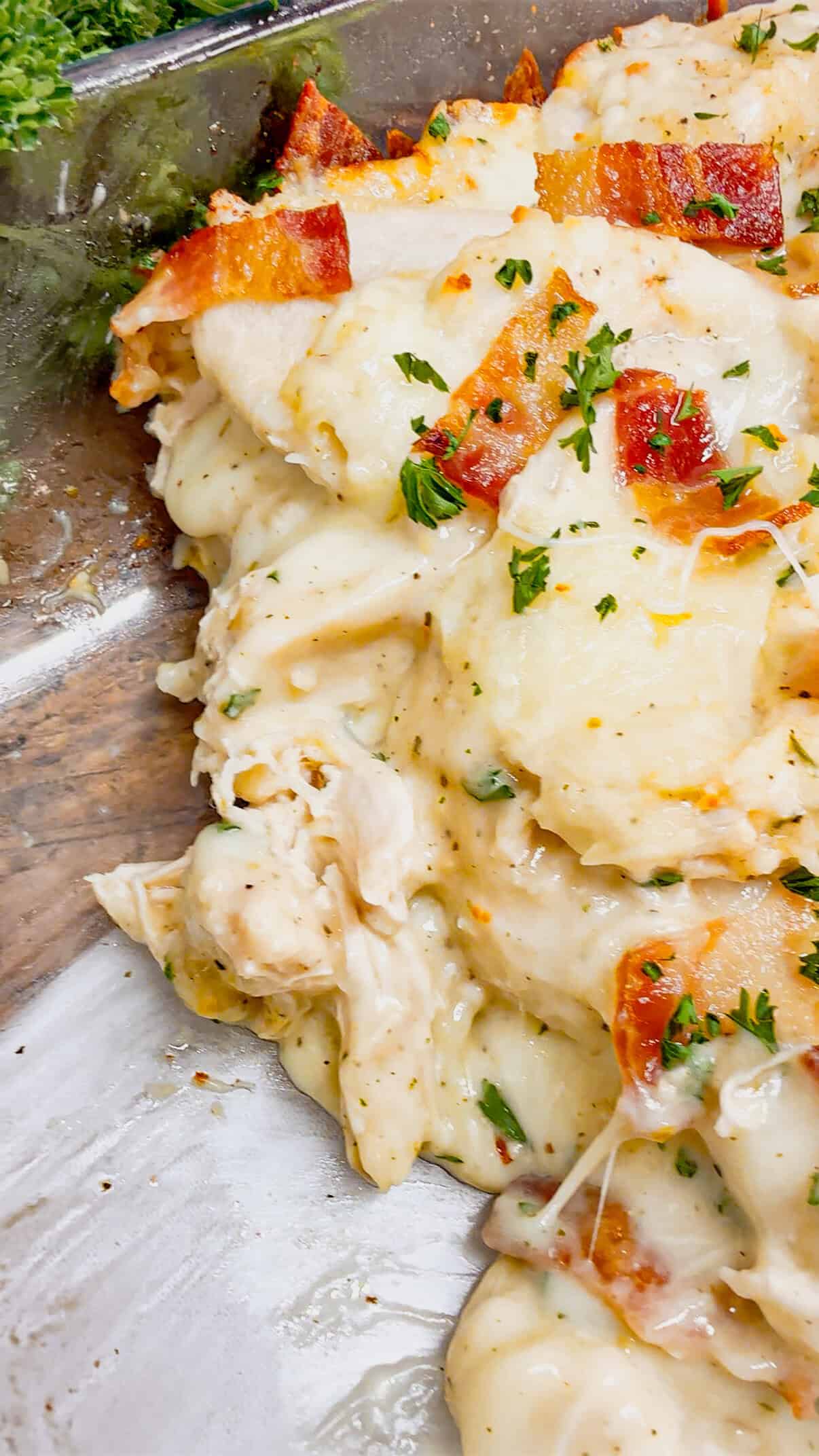 Chicken Alfredo Pierogi Casserole is an easy but hearty dinner recipe that combines two beloved classic foods into one dish. This creamy casserole is loaded with shredded rotisserie chicken, alfredo sauce, pierogies, mozzarella cheese and chopped bacon.