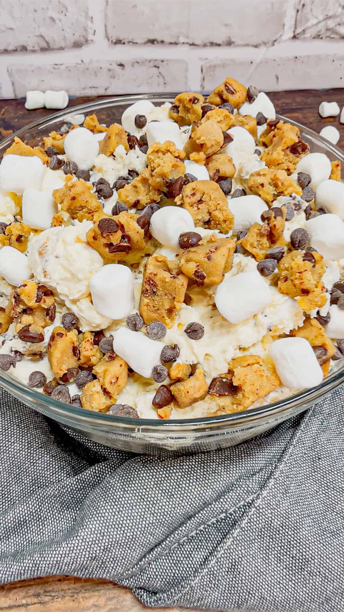 Cookie Dough Fluff is a quick and easy no bake dessert recipe perfect for summer. This rich and creamy dessert is loaded with cream cheese, Cool Whip, instant vanilla pudding, mini marshmallows, chunks of Pillsbury chocolate chip cookie dough and mini chocolate chips.