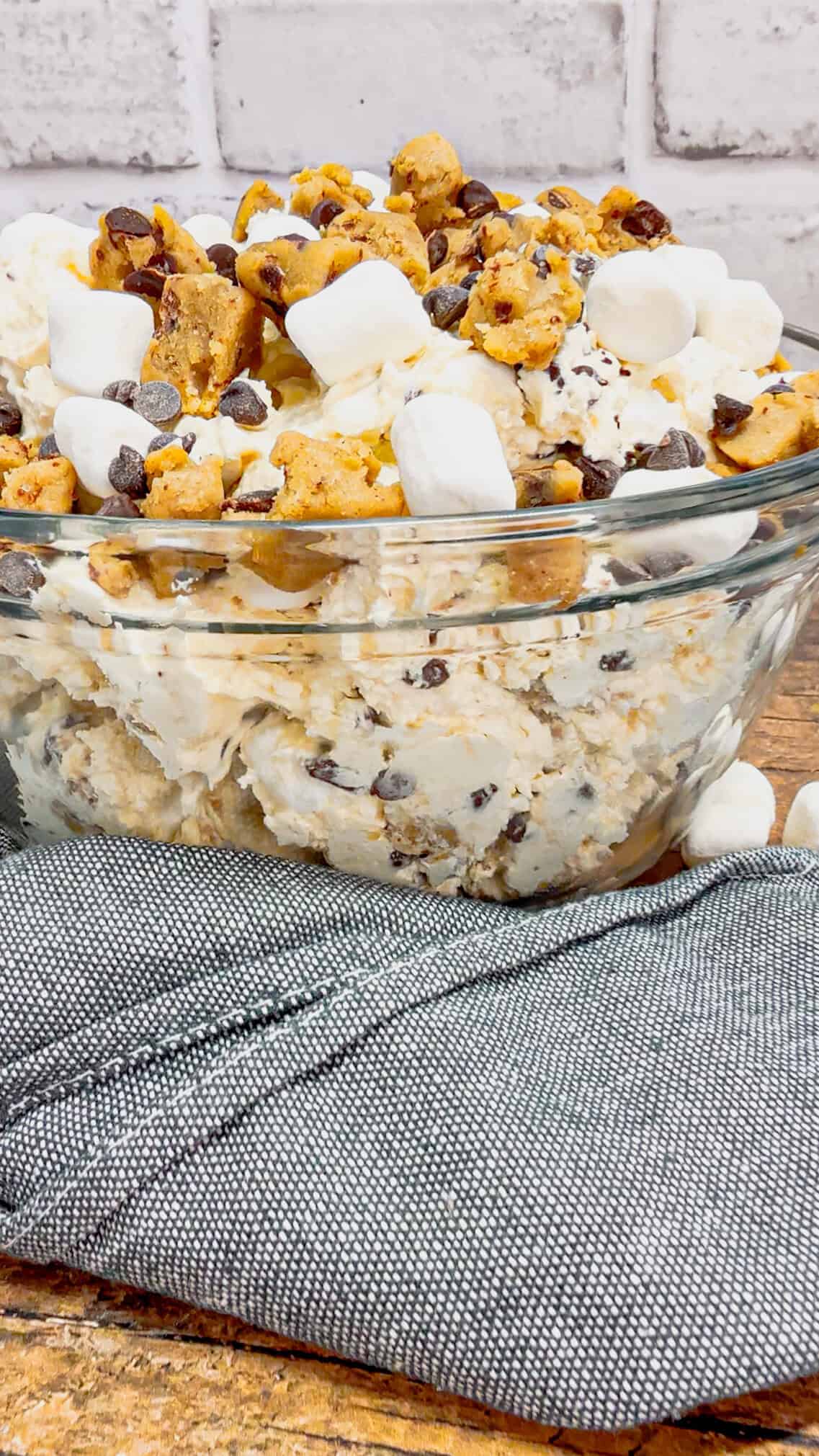 Cookie Dough Fluff is a quick and easy no bake dessert recipe perfect for summer. This rich and creamy dessert is loaded with cream cheese, Cool Whip, instant vanilla pudding, mini marshmallows, chunks of Pillsbury chocolate chip cookie dough and mini chocolate chips.