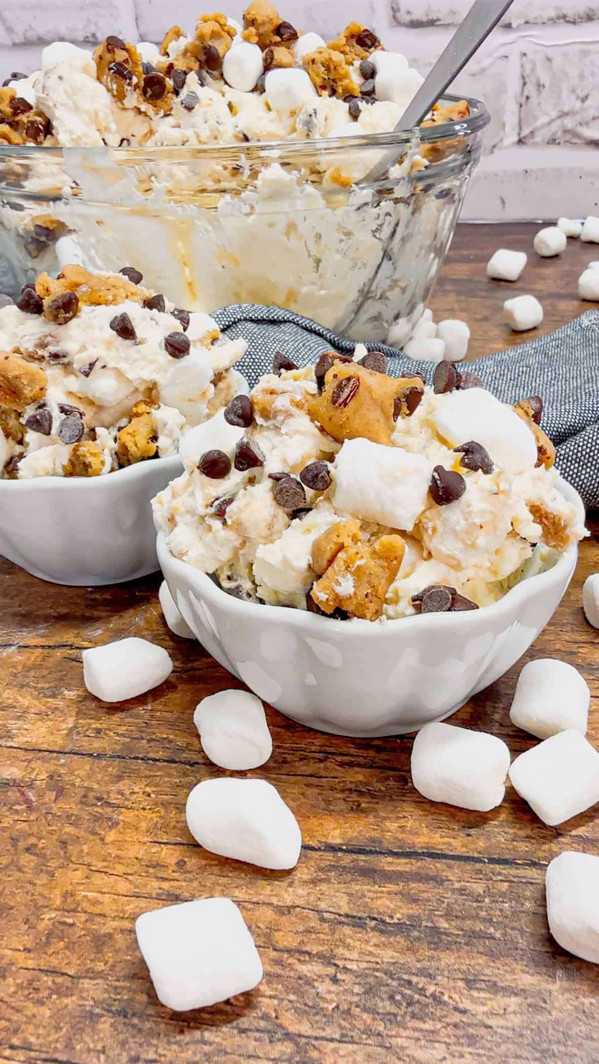 Cookie Dough Fluff is a quick and easy no bake dessert recipe perfect for summer. This rich and creamy dessert is loaded with cream cheese, Cool Whip, instant vanilla pudding, mini marshmallows, chunks of Pillsbury chocolate chip cookie dough and mini chocolate chips.
