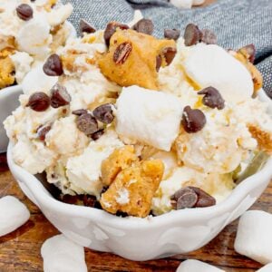 Cookie Dough Fluff is a quick and easy no bake dessert recipe perfect for summer. This rich and creamy dessert is loaded with cream cheese, Cool Whip, instant vanilla pudding, mini marshmallows, chunks of Pillsbury chocolate chip cookie dough and mini chocolate chips.