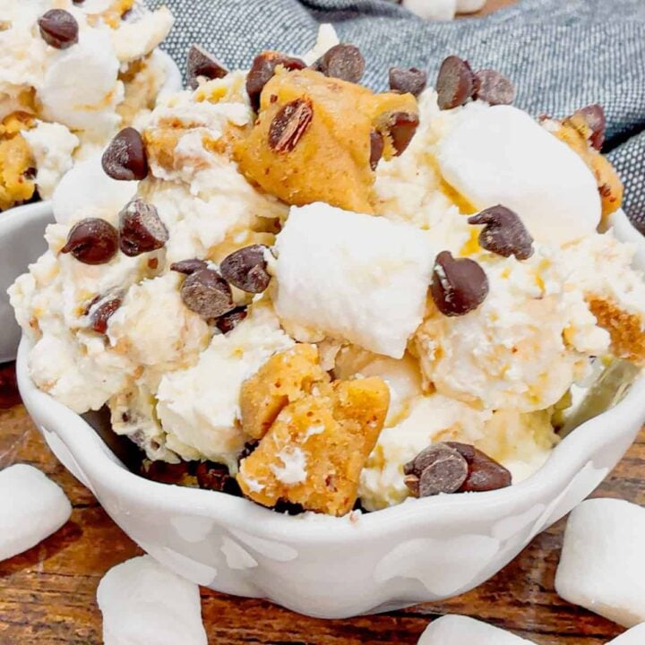 Cookie Dough Fluff is a quick and easy no bake dessert recipe perfect for summer. This rich and creamy dessert is loaded with cream cheese, Cool Whip, instant vanilla pudding, mini marshmallows, chunks of Pillsbury chocolate chip cookie dough and mini chocolate chips.