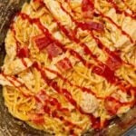Crock Pot BBQ Alfredo Chicken Spaghetti is a flavourful pasta recipe the whole family will love. This slow cooker spaghetti recipe is loaded with chicken breast chunks and chopped bacon and is all tossed in a creamy garlic parmesan alfredo sauce with some barbecue sauce added for a fun flavour twist.