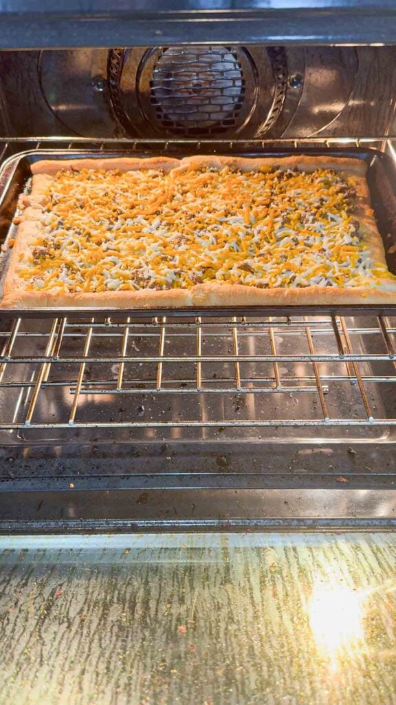 taco pizza baking in the oven