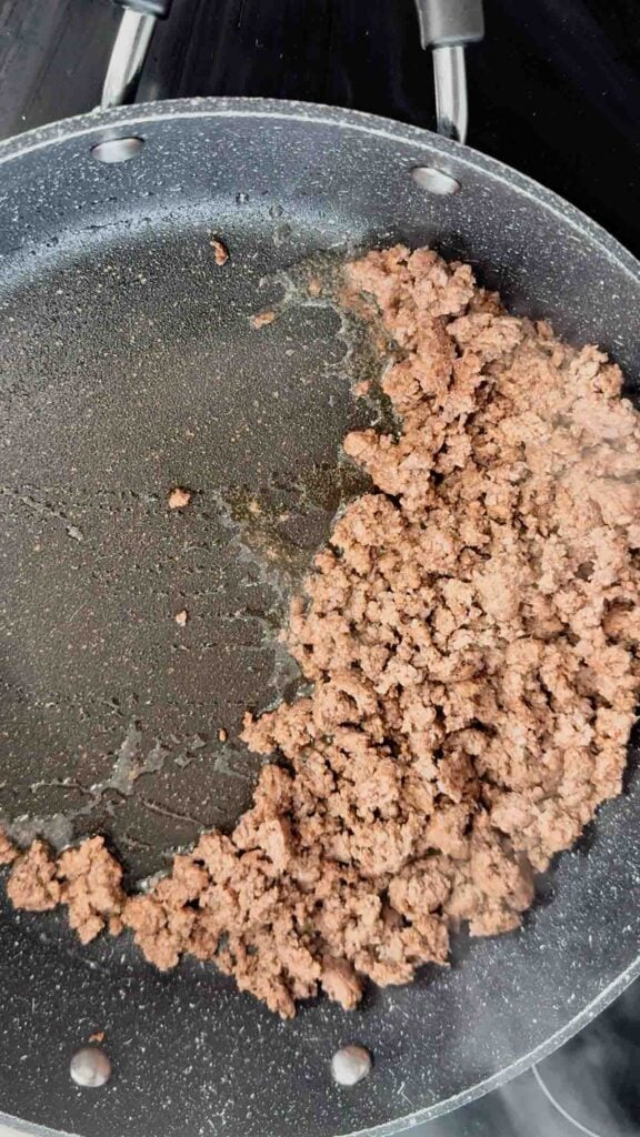 cooked ground beef in a skillet