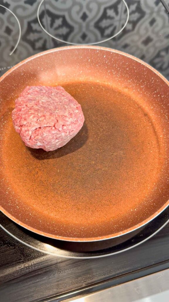 raw ground beef in a skillet