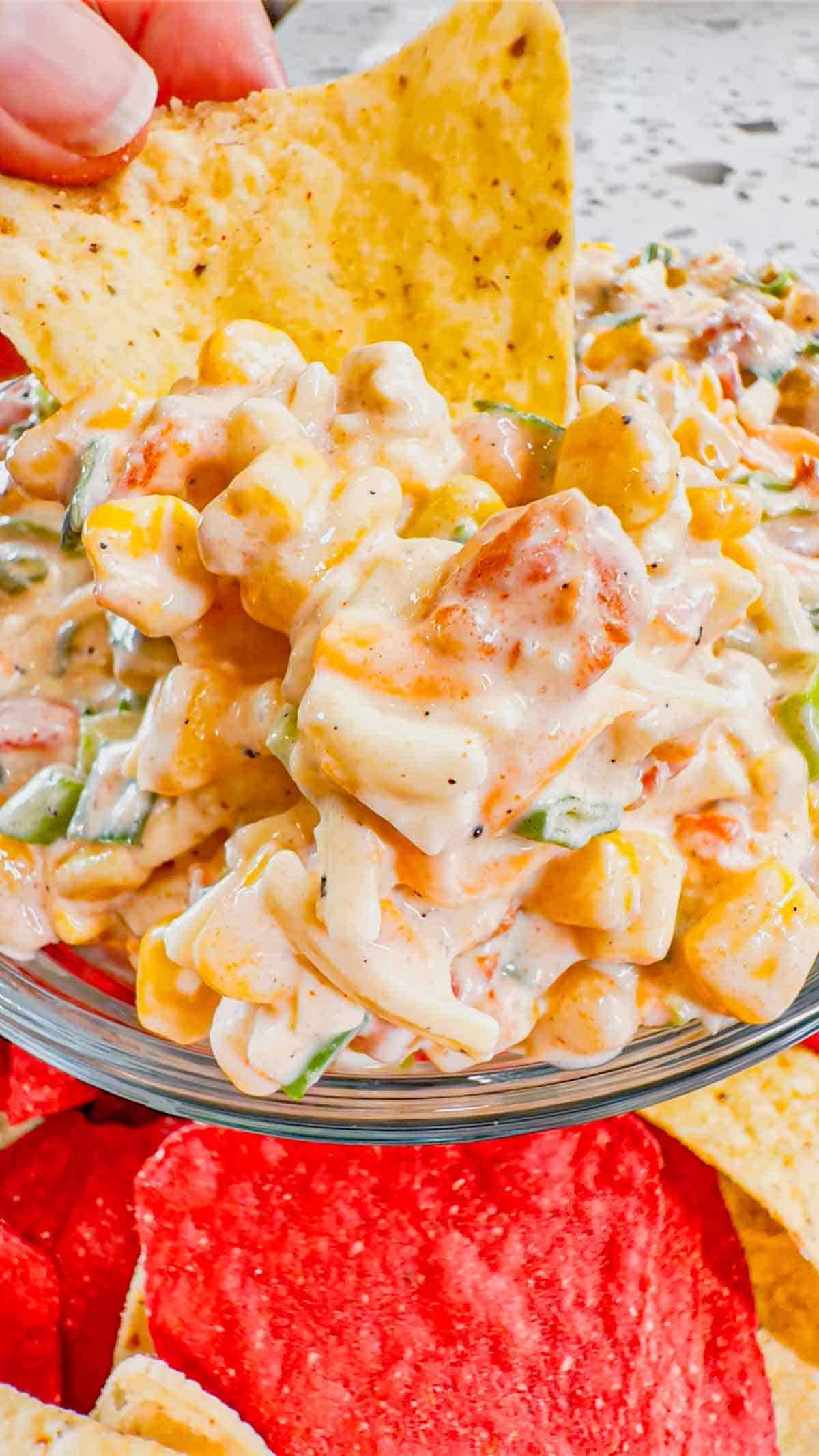 Corn Dip with Cream Cheese is a tasty cold dip recipe made with canned corn, cream cheese, sour cream, Rotel, shredded cheese and chopped green onions.