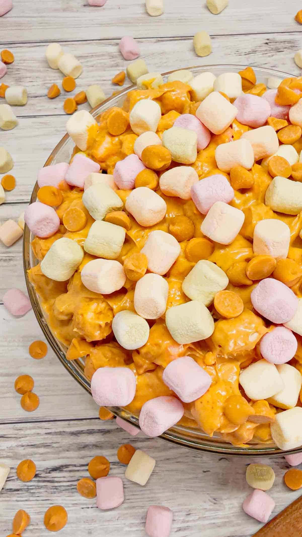 Peanut Butter Butterscotch Confetti Fluff is an easy no bake dessert recipe perfect for potlucks and gatherings. This tasty dessert made with butterscotch pudding, cream cheese, peanut butter, Cool Whip, butterscotch chips and colourful mini marshmallows is inspired by the classic peanut butter butterscotch marshmallow squares we all love.
