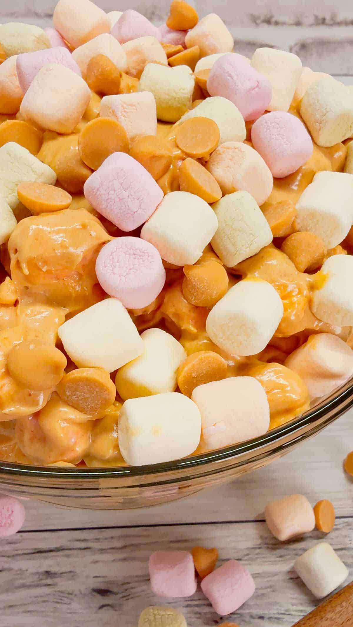 Peanut Butter Butterscotch Confetti Fluff is an easy no bake dessert recipe perfect for potlucks and gatherings. This tasty dessert made with butterscotch pudding, cream cheese, peanut butter, Cool Whip, butterscotch chips and colourful mini marshmallows is inspired by the classic peanut butter butterscotch marshmallow squares we all love.