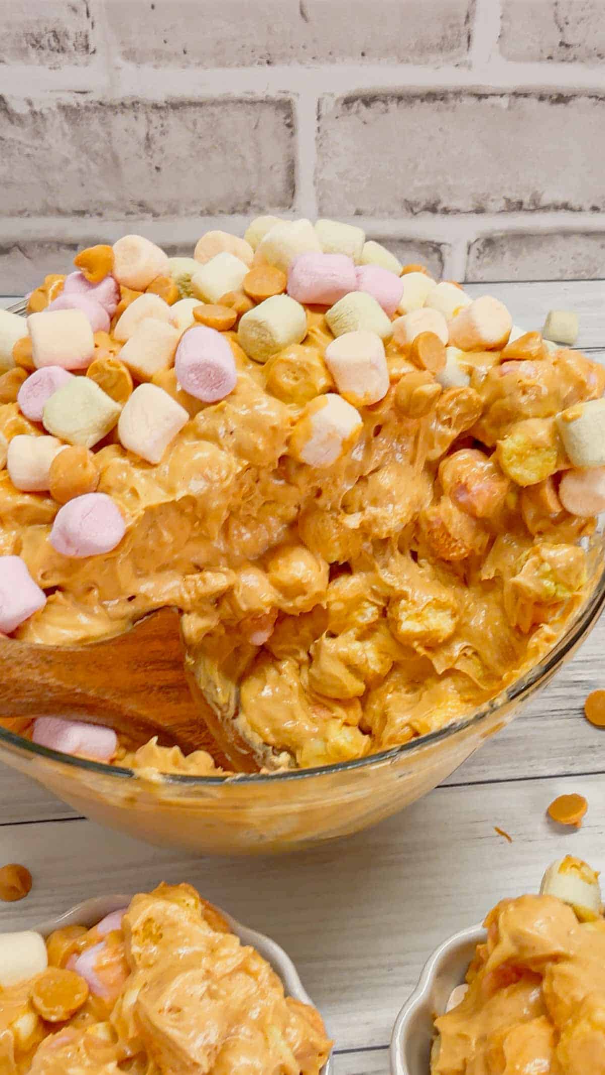 Peanut Butter Butterscotch Confetti Fluff is an easy no bake dessert recipe perfect for potlucks and gatherings. This tasty dessert made with butterscotch pudding, cream cheese, peanut butter, Cool Whip, butterscotch chips and colourful mini marshmallows is inspired by the classic peanut butter butterscotch marshmallow squares we all love.