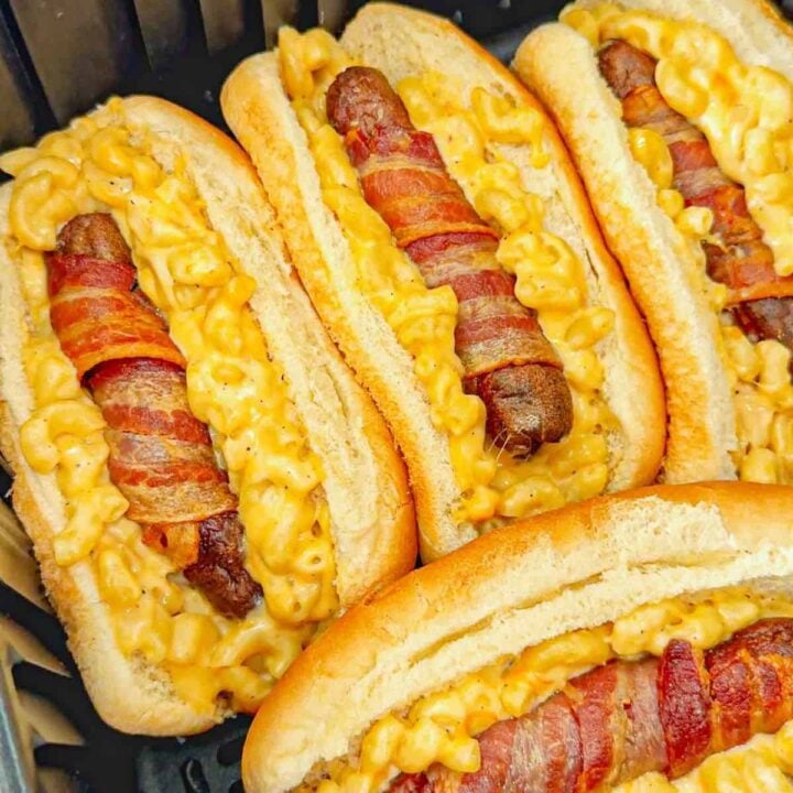 Air Fryer Bacon Wrapped Mac and Cheese Dogs are a fun and easy dinner the whole family will love. The bacon wrapped wieners are air fried until crispy and then placed on buns loaded with creamy mac and cheese and toasted to perfection.