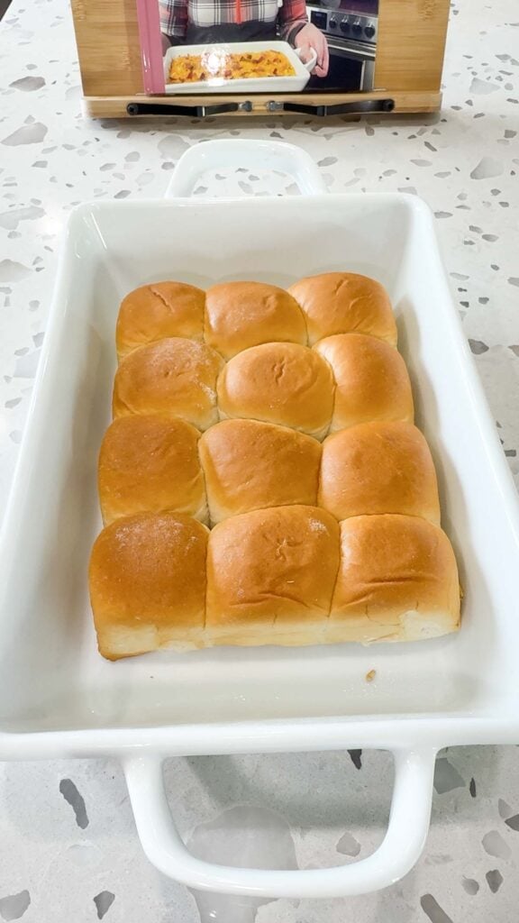 twelve king's hawaiian rolls in a baking dish