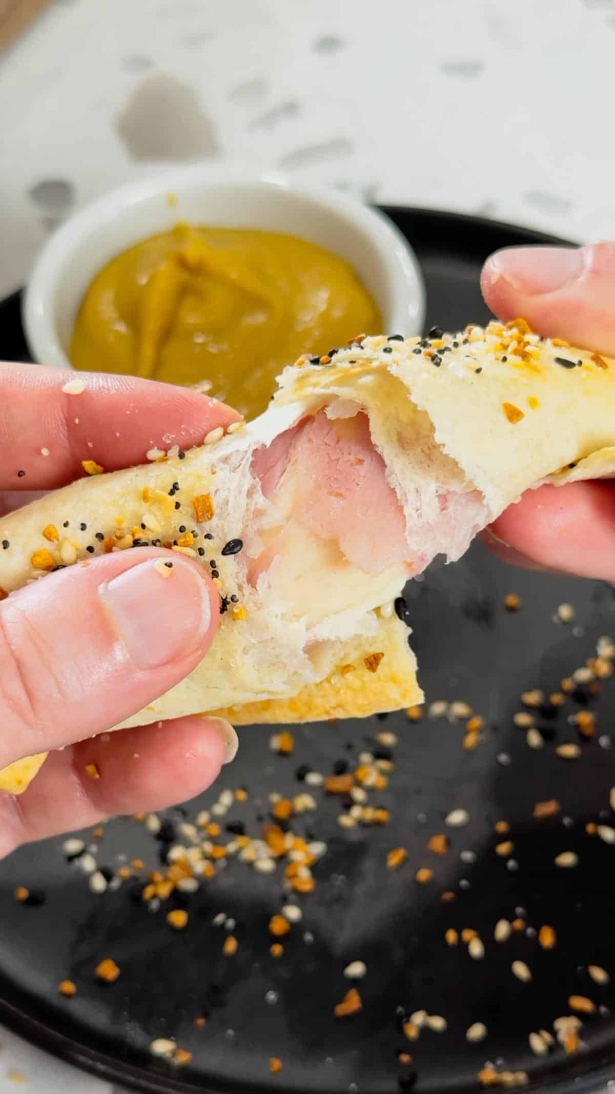 Air Fryer Ham and Cheese Sticks are an easy snack perfect for a quick lunch or party food. Ham and string cheese are rolled up inside flour tortillas, brushed with melted butter and topped with everything bagel seasoning before being toasted to perfection in an air fryer.