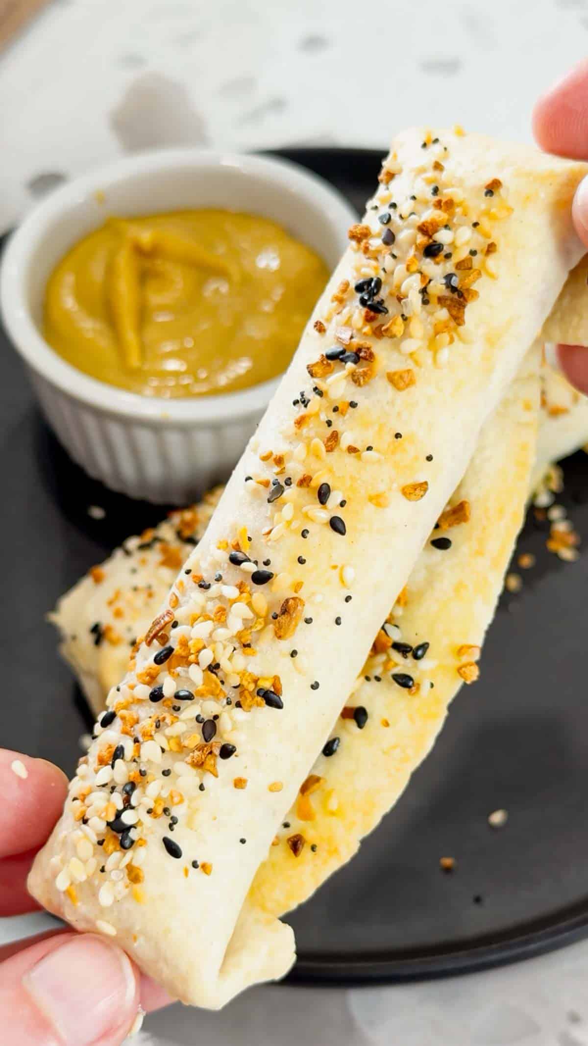 Air Fryer Ham and Cheese Sticks are an easy snack perfect for a quick lunch or party food. Ham and string cheese are rolled up inside flour tortillas, brushed with melted butter and topped with everything bagel seasoning before being toasted to perfection in an air fryer.