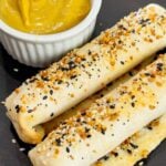Air Fryer Ham and Cheese Sticks are an easy snack perfect for a quick lunch or party food. Ham and string cheese are rolled up inside flour tortillas, brushed with melted butter and topped with everything bagel seasoning before being toasted to perfection in an air fryer.