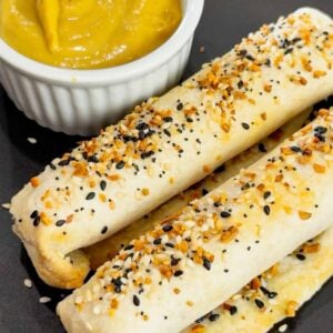 Air Fryer Ham and Cheese Sticks are an easy snack perfect for a quick lunch or party food. Ham and string cheese are rolled up inside flour tortillas, brushed with melted butter and topped with everything bagel seasoning before being toasted to perfection in an air fryer.