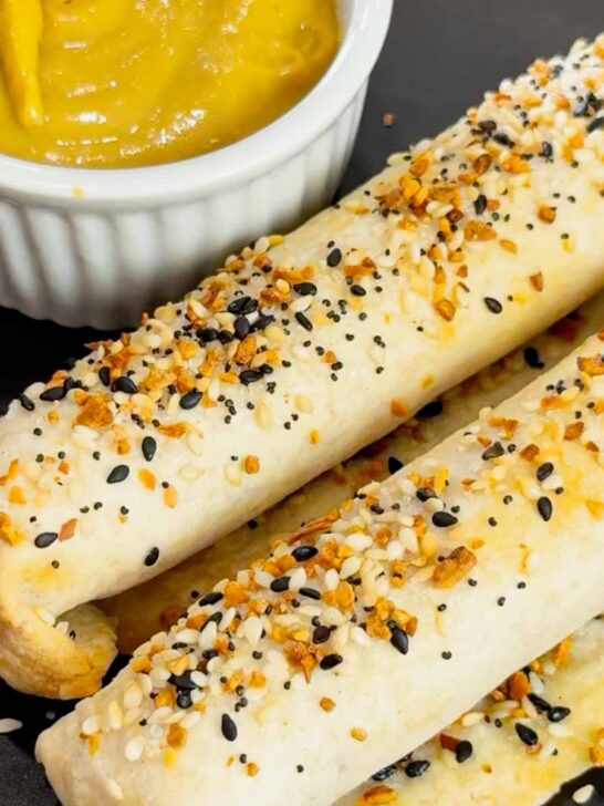 Air Fryer Ham and Cheese Sticks are an easy snack perfect for a quick lunch or party food. Ham and string cheese are rolled up inside flour tortillas, brushed with melted butter and topped with everything bagel seasoning before being toasted to perfection in an air fryer.
