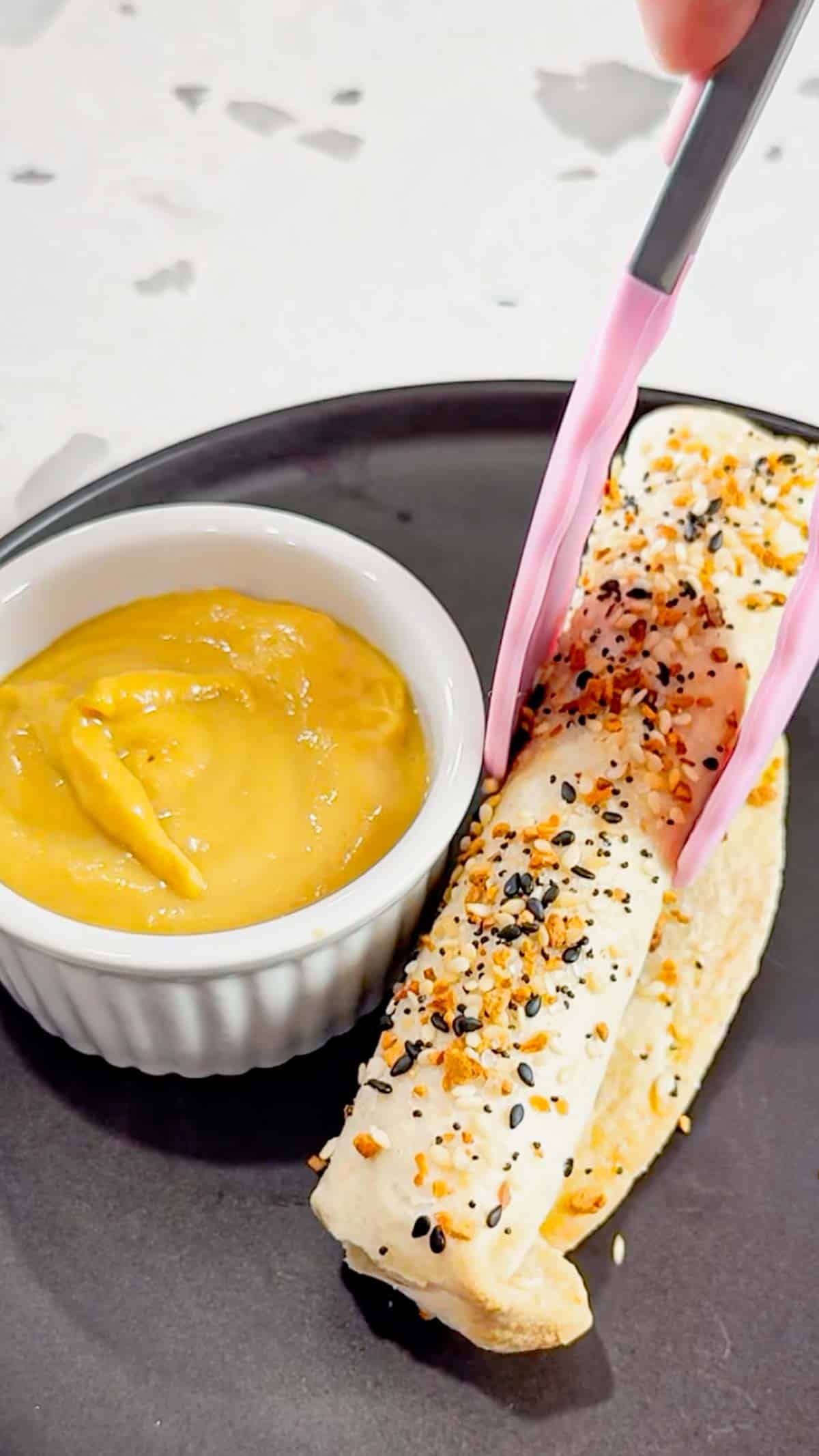 Air Fryer Ham and Cheese Sticks are an easy snack perfect for a quick lunch or party food. Ham and string cheese are rolled up inside flour tortillas, brushed with melted butter and topped with everything bagel seasoning before being toasted to perfection in an air fryer.