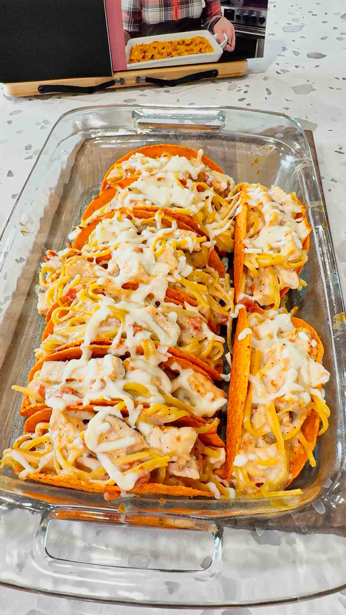Chicken Alfredo Tacos are a fun and easy dinner recipe perfect for busy weeknights. Cheesy Blasted Stand N Stuff taco shells are stuffed with creamy linguine alfredo loaded with grilled chicken chunks, Rotel and mozzarella cheese.