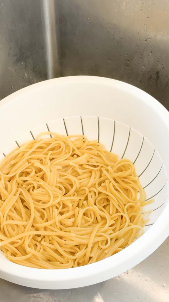 cooked linguine in a colander
