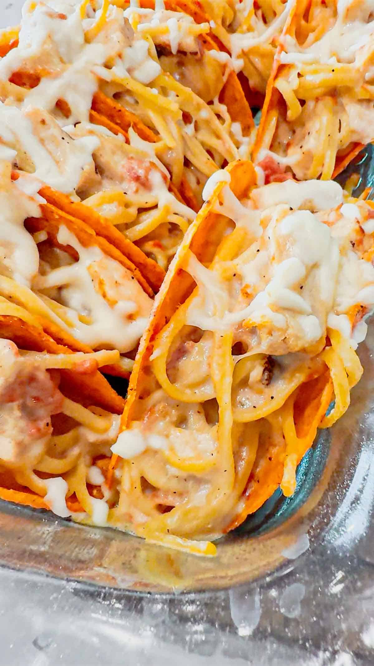 Chicken Alfredo Tacos are a fun and easy dinner recipe perfect for busy weeknights. Cheesy Blasted Stand N Stuff taco shells are stuffed with creamy linguine alfredo loaded with grilled chicken chunks, Rotel and mozzarella cheese.