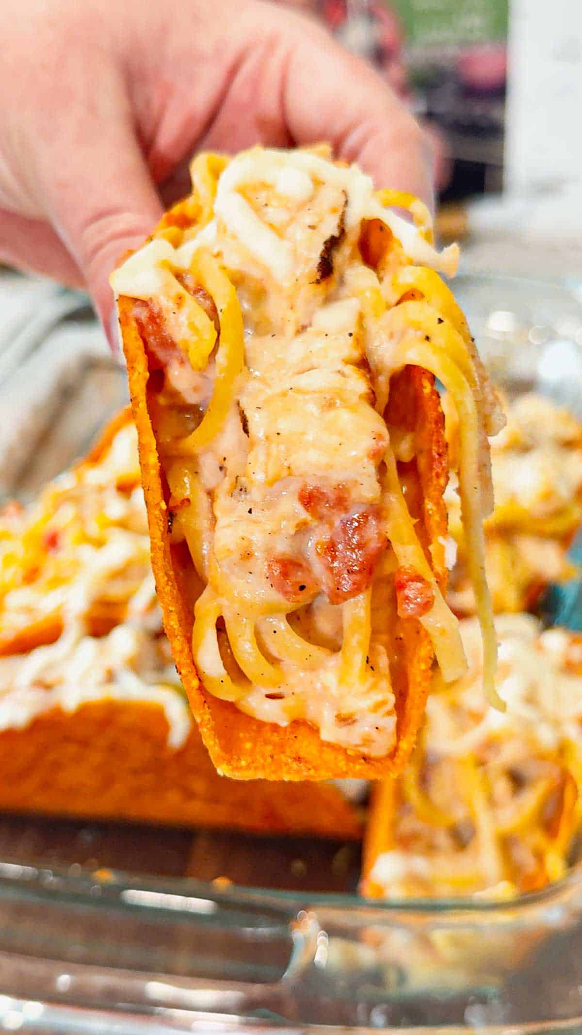 Chicken Alfredo Tacos are a fun and easy dinner recipe perfect for busy weeknights. Cheesy Blasted Stand N Stuff taco shells are stuffed with creamy linguine alfredo loaded with grilled chicken chunks, Rotel and mozzarella cheese.