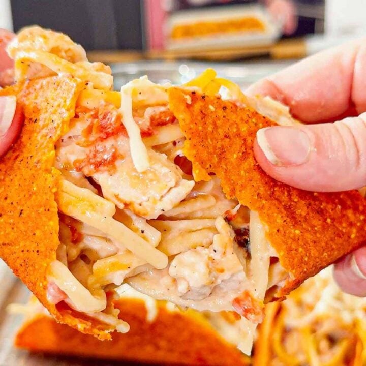 Chicken Alfredo Tacos are a fun and easy dinner recipe perfect for busy weeknights. Cheesy Blasted Stand N Stuff taco shells are stuffed with creamy linguine alfredo loaded with grilled chicken chunks, Rotel and mozzarella cheese.