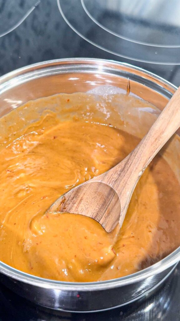 spicy peanut butter sauce in a pot