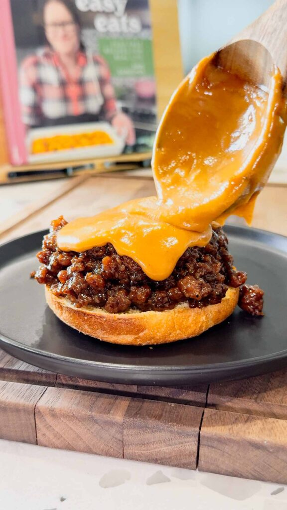 Peanut Butter and Jelly Sloppy Joes are a fun twist on a classic family dinner recipe. These tasty sandwiches are loaded with ground beef tossed in a strawberry jam and bbq sauce mixture and topped with a coconut milk peanut butter sauce with a bit of a kick from some Thai sweet chili sauce.