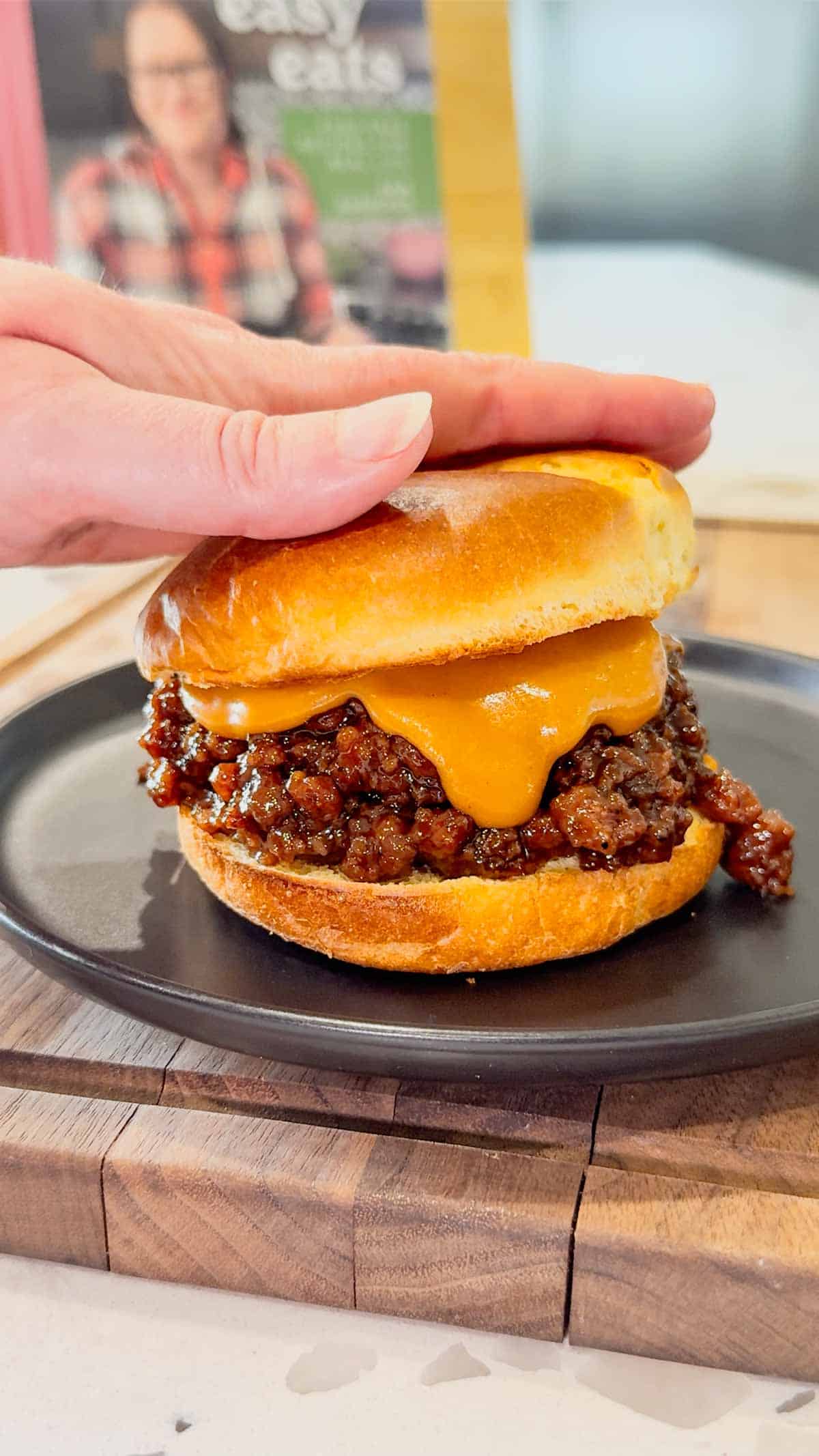 Peanut Butter and Jelly Sloppy Joes are a fun twist on a classic family dinner recipe. These tasty sandwiches are loaded with ground beef tossed in a strawberry jam and bbq sauce mixture and topped with a coconut milk peanut butter sauce with a bit of a kick from some Thai sweet chili sauce.