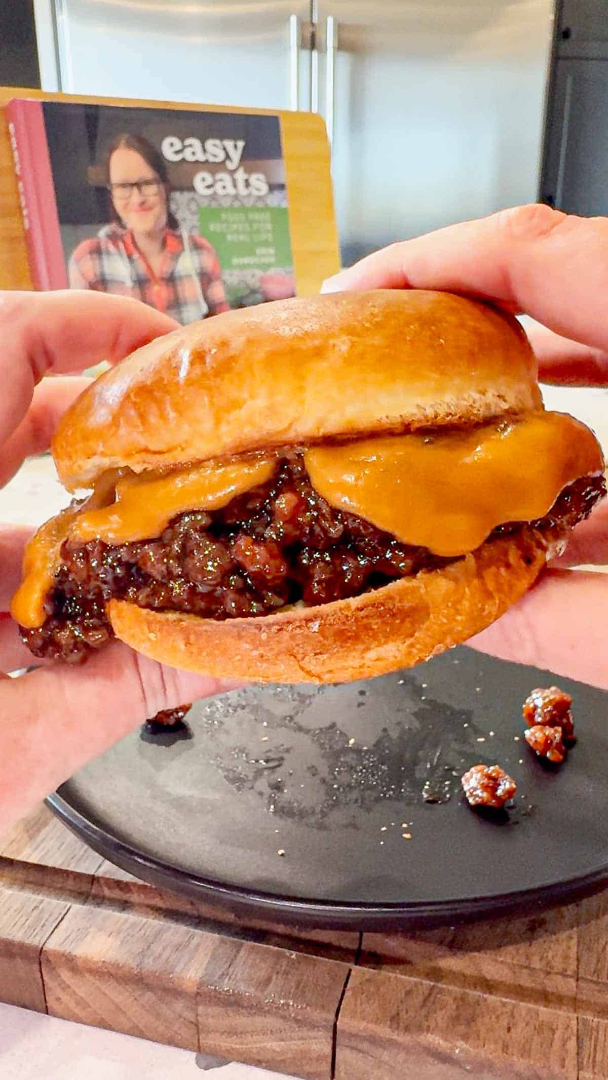 Peanut Butter and Jelly Sloppy Joes are a fun twist on a classic family dinner recipe. These tasty sandwiches are loaded with ground beef tossed in a strawberry jam and bbq sauce mixture and topped with a coconut milk peanut butter sauce with a bit of a kick from some Thai sweet chili sauce.