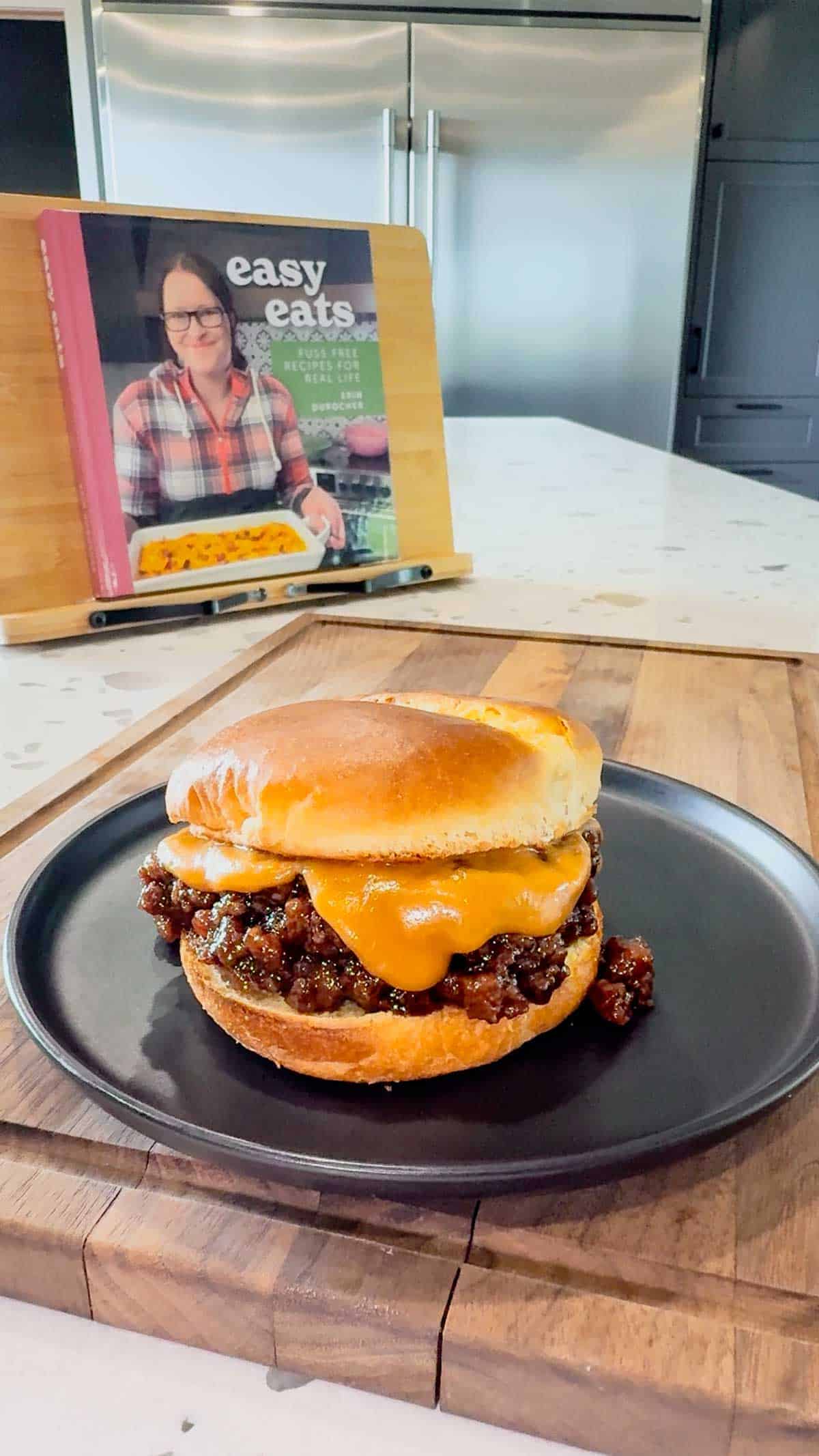Peanut Butter and Jelly Sloppy Joes are a fun twist on a classic family dinner recipe. These tasty sandwiches are loaded with ground beef tossed in a strawberry jam and bbq sauce mixture and topped with a coconut milk peanut butter sauce with a bit of a kick from some Thai sweet chili sauce.