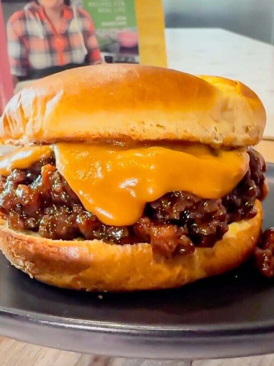Peanut Butter and Jelly Sloppy Joes are a fun twist on a classic family dinner recipe. These tasty sandwiches are loaded with ground beef tossed in a strawberry jam and bbq sauce mixture and topped with a coconut milk peanut butter sauce with a bit of a kick from some Thai sweet chili sauce.