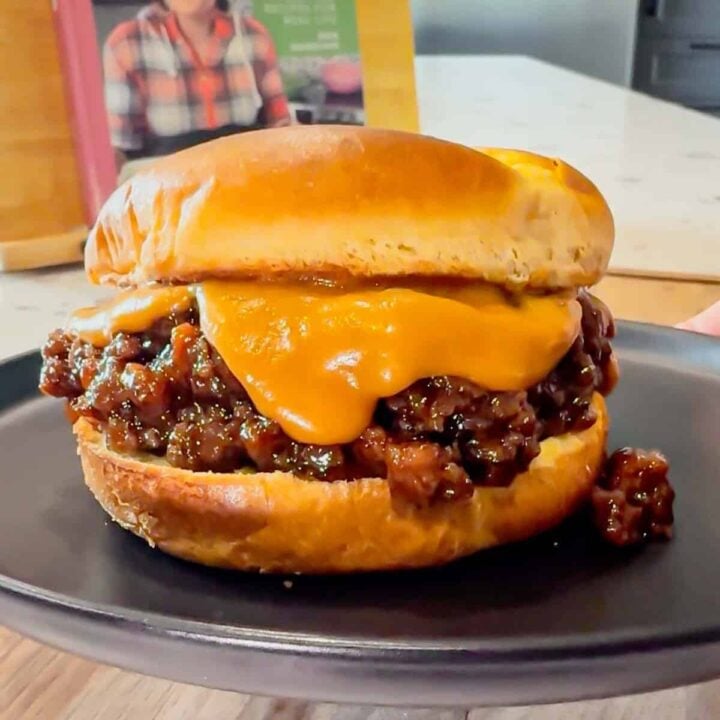 Peanut Butter and Jelly Sloppy Joes are a fun twist on a classic family dinner recipe. These tasty sandwiches are loaded with ground beef tossed in a strawberry jam and bbq sauce mixture and topped with a coconut milk peanut butter sauce with a bit of a kick from some Thai sweet chili sauce.