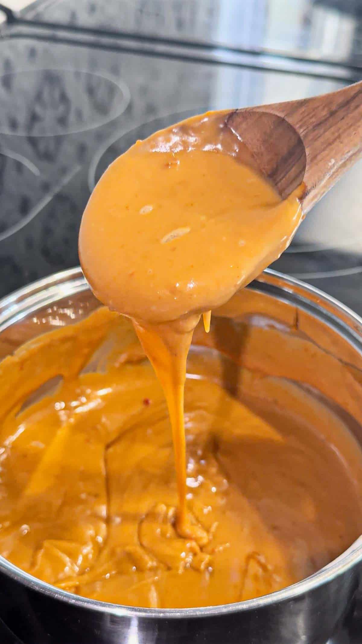Peanut Butter and Jelly Sloppy Joes are a fun twist on a classic family dinner recipe. These tasty sandwiches are loaded with ground beef tossed in a strawberry jam and bbq sauce mixture and topped with a coconut milk peanut butter sauce with a bit of a kick from some Thai sweet chili sauce.