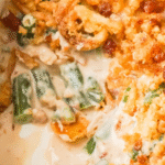 Cream Cheese and Bacon Green Bean Casserole is a classic holiday dinner side dish recipe. This creamy green bean casserole is perfect for Thanksgiving and Christmas. This dish is loaded with frozen cut green beans, cream cheese, onion soup mix, and crumbled bacon all topped with crispy fried onions and Ritz cracker crumbs.