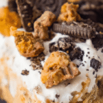 No Bake Oreo Peanut Butter Cup Cheesecake is a decadent dessert perfect for holidays, potlucks and even just to treat yourself on a boring weeknight. This easy no bake dessert starts with an Oreo cookie pie crust and has a creamy peanut butter cheesecake filling topped with whipped cream, peanut butter cups and crumbled Oreos.
