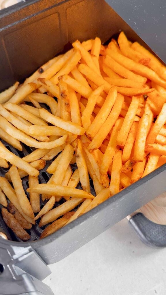 French fries in an air fryer basket
