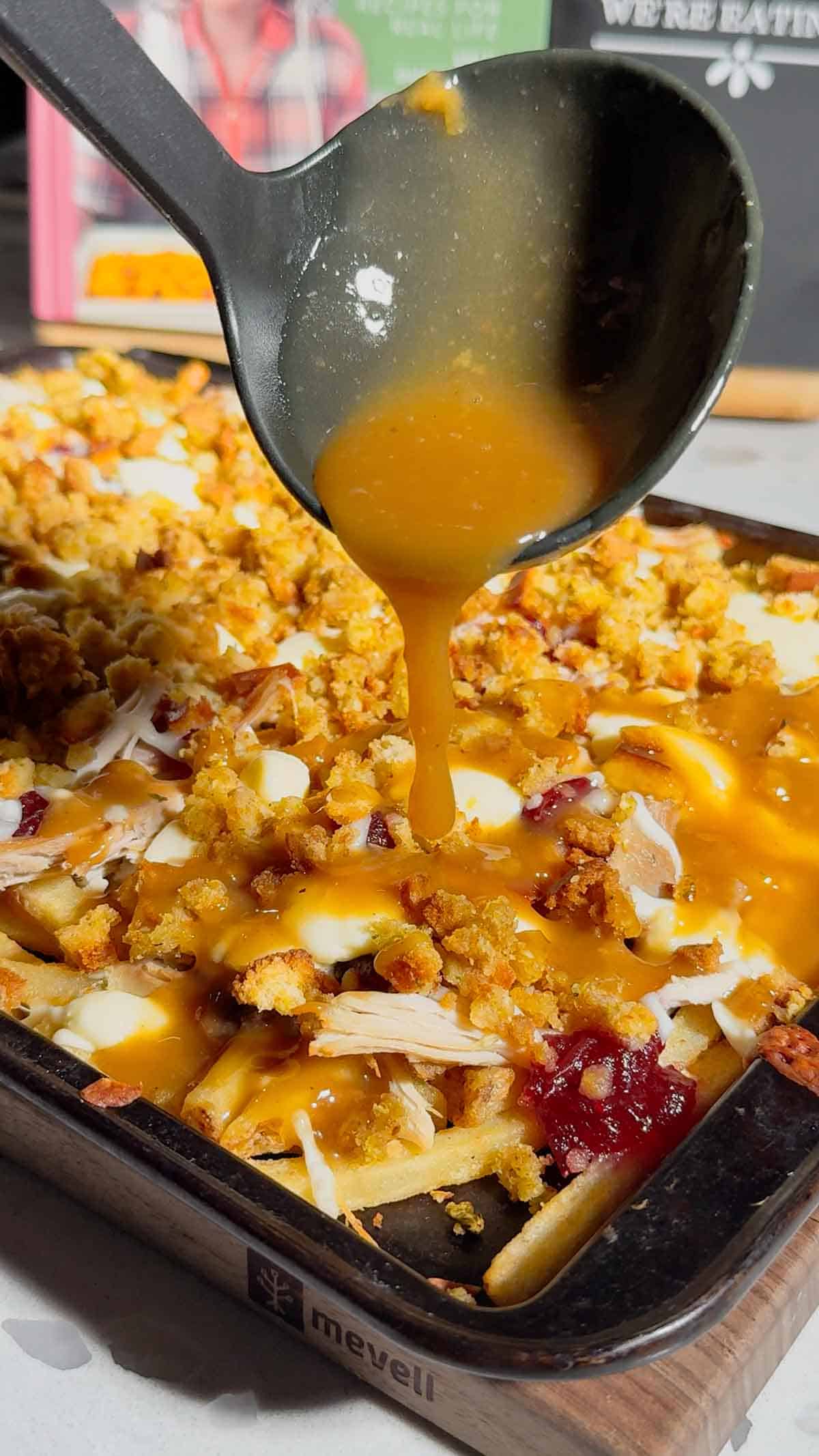 Turn your Thanksgiving leftovers into the ultimate comfort food with this Sheet Pan Thanksgiving Poutine! Crispy french fries loaded with shredded turkey, cheese curds, mozzarella, stuffing, cranberry sauce, and plenty of rich gravy. It’s easy, melty, over-the-top delicious, and the perfect way to reinvent holiday leftovers. Save this recipe for your post-Thanksgiving cravings!