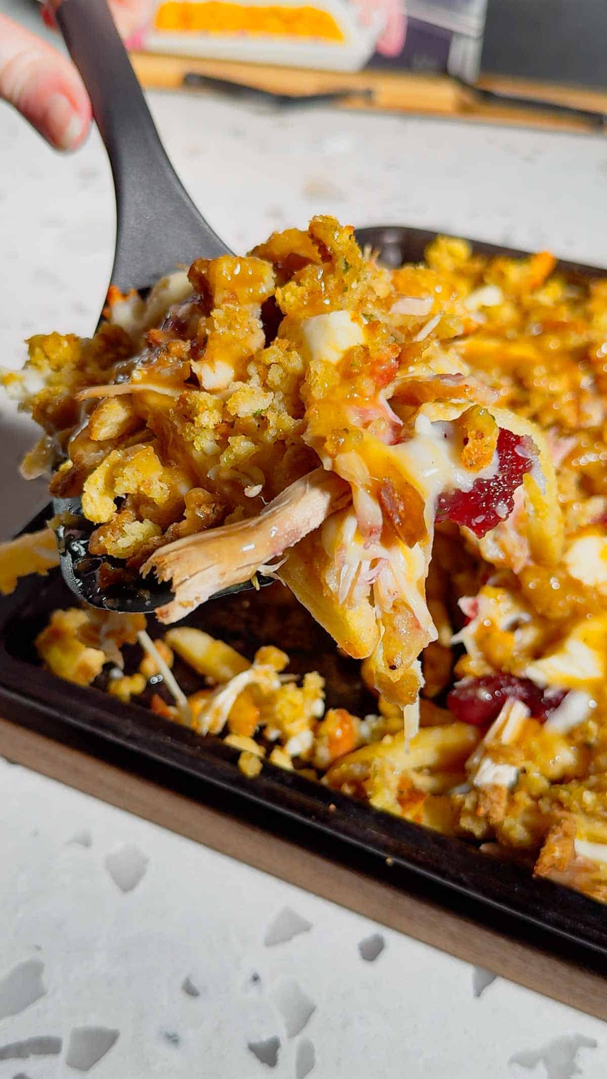 Turn your Thanksgiving leftovers into the ultimate comfort food with this Sheet Pan Thanksgiving Poutine! Crispy french fries loaded with shredded turkey, cheese curds, mozzarella, stuffing, cranberry sauce, and plenty of rich gravy. It’s easy, melty, over-the-top delicious, and the perfect way to reinvent holiday leftovers. Save this recipe for your post-Thanksgiving cravings!