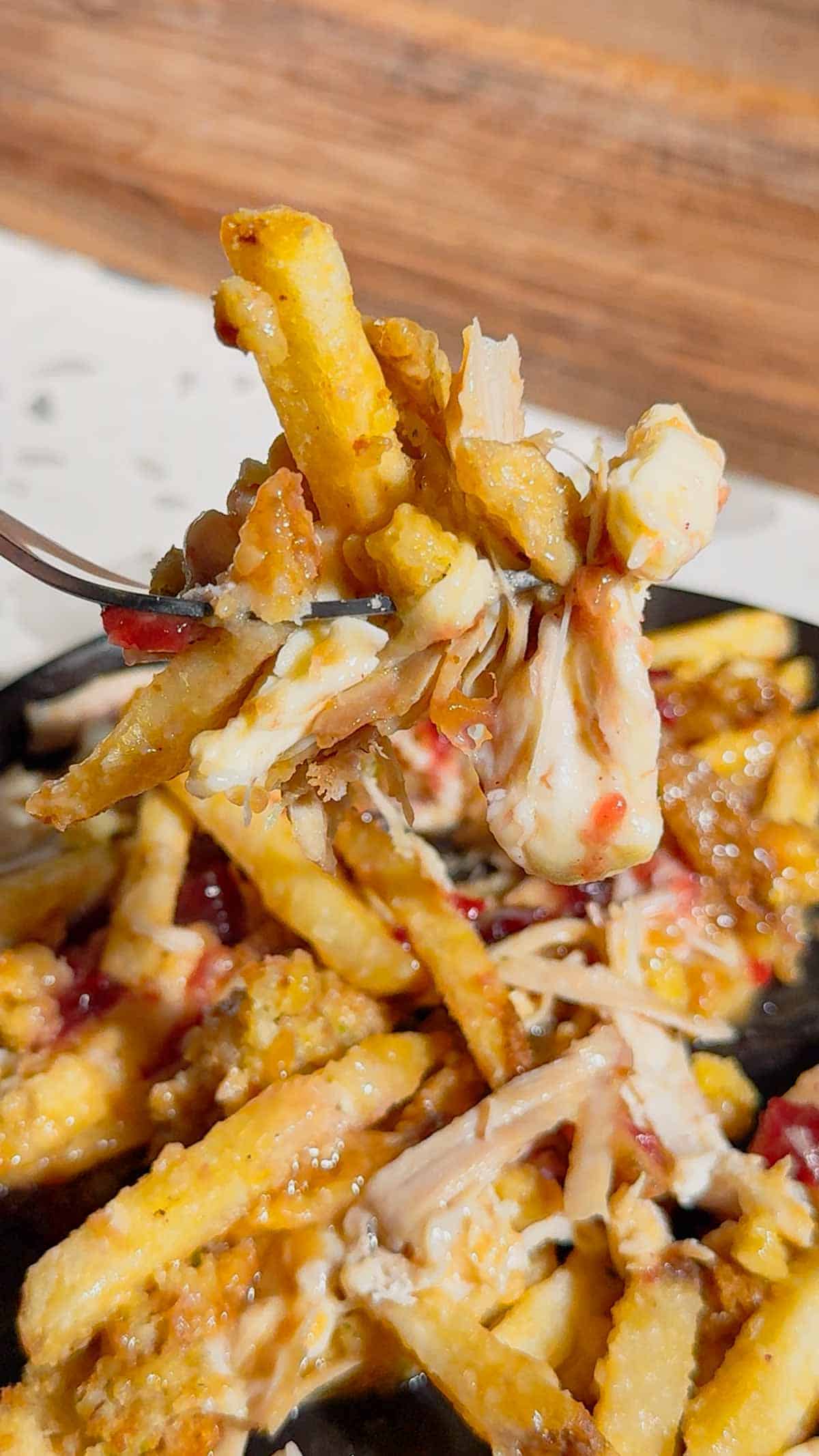 Turn your Thanksgiving leftovers into the ultimate comfort food with this Sheet Pan Thanksgiving Poutine! Crispy french fries loaded with shredded turkey, cheese curds, mozzarella, stuffing, cranberry sauce, and plenty of rich gravy. It’s easy, melty, over-the-top delicious, and the perfect way to reinvent holiday leftovers. Save this recipe for your post-Thanksgiving cravings!