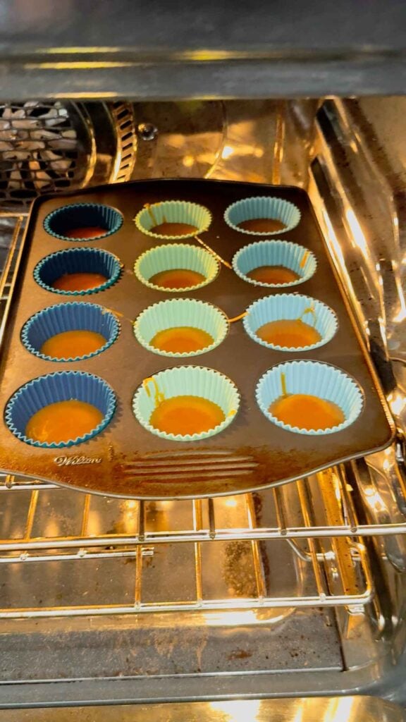 ritz cracker christmas crack baking in muffin tins in the oven