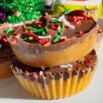 Get ready for the ultimate sweet-and-salty holiday treat with these Peanut Butter Ritz Crack Christmas Crack Cookies! Made in muffin tins, this fun twist on classic Christmas crack uses Peanut Butter Ritz Cracker Snackwiches smothered in rich, buttery toffee, topped with melted semi-sweet chocolate, and finished with festive sprinkles. Easy to make, irresistibly crunchy, and perfectly portioned, these holiday cookies are guaranteed to disappear fast at parties, on cookie trays, or as edible gifts.